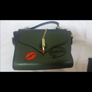 Chain lip flap cross body bag